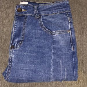 high waisted distressed blue jeans